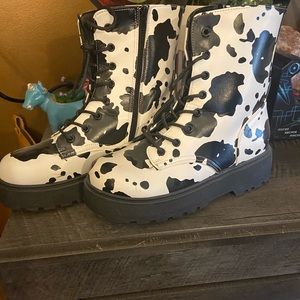Cow print women’s boots super cute says size 11 fits like a 9